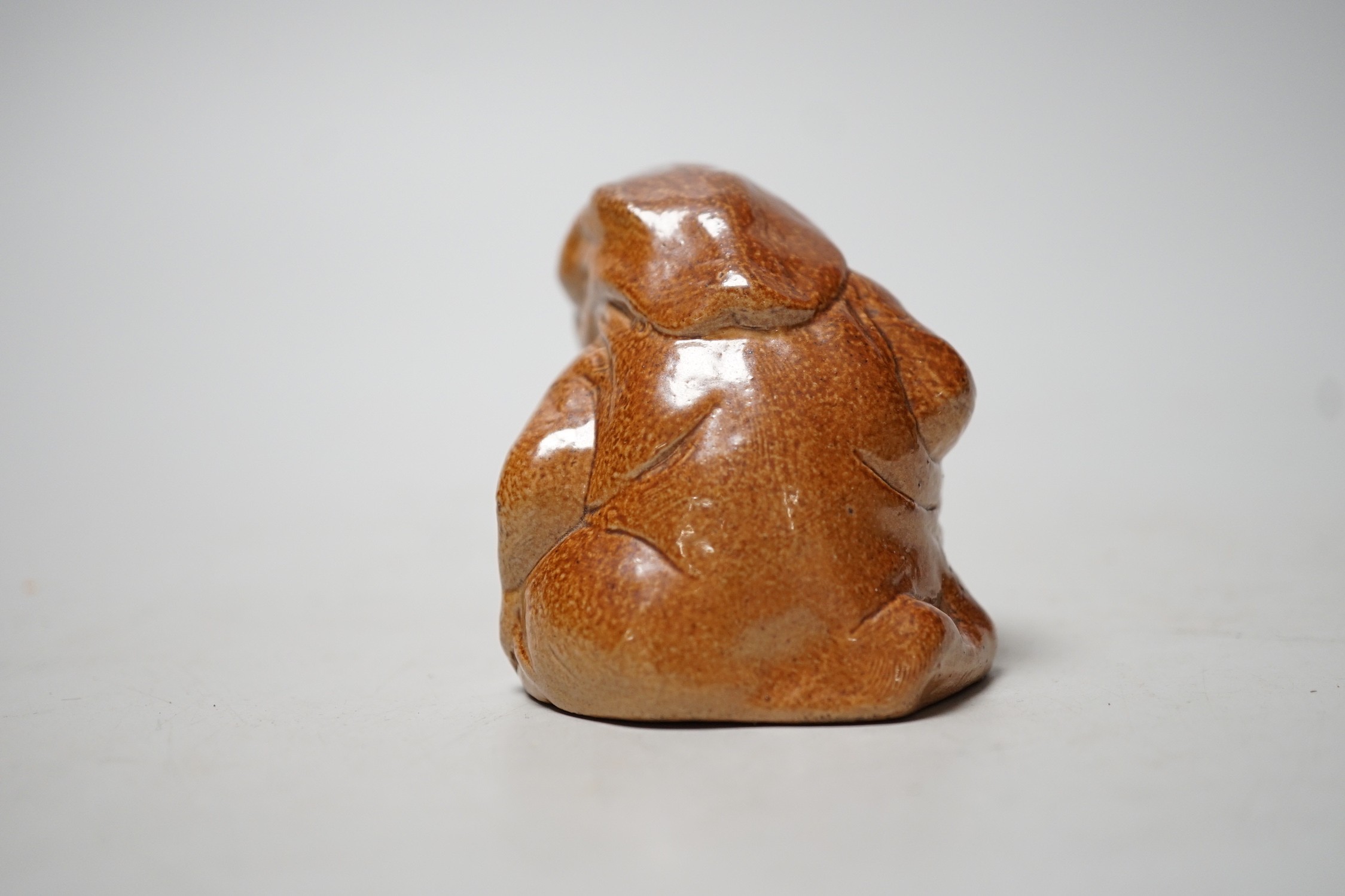 An unusual Royal Doulton salt-glazed stoneware grotesque figure. 6cm tall